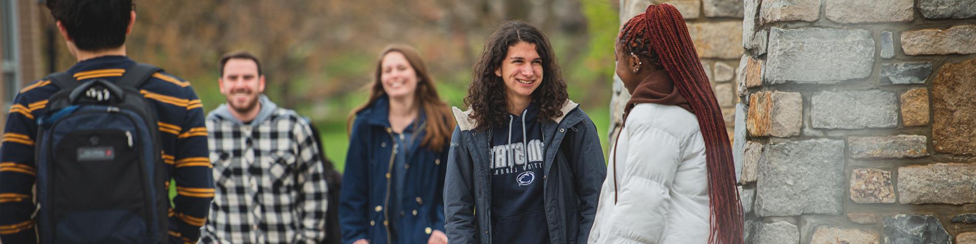 Students chatting in Perkins Plaza